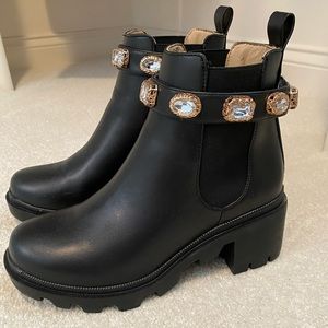 Black Steve Madden booties with removable jewels.